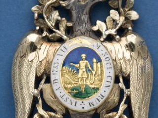 Detail of the back side of the gold-and-enamel body of the Diamond Eagle insignia